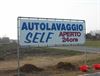 distributore benzina autolavaggio uboldi fenegrò striscione venduto